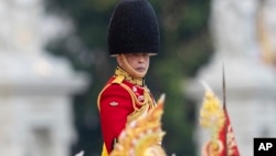 Thailand's King Maha Vajiralongkorn reviews the honor guard during a military parade in honor of his 72nd birthday in Bangkok, Thailand, Dec. 3, 2024.