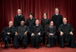 FILE - The justices of the U.S. Supreme Court are seen gathered for a formal group photo at the Supreme Court building in Washington, Nov. 30, 2018. Justice Ruth Bader Ginsburg is seated second from right.