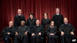 FILE - The justices of the U.S. Supreme Court gather for a formal group portrait at the Supreme Court Building in Washington, Nov. 30, 2018.