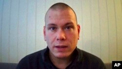 A frame grab made Oct. 14, 2021, from a video posted online by and showing Espen Andersen Braathen, a 37-year-old Danish citizen, who was arrested Wednesday night.