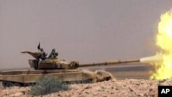  داعش او ياغي اتحاد چې کرد مليشه يې ملګرتيا کوي د دويې ترمينځ د عراق پولې ته نزدې الهول علاقه کې توده جګړه روانه ده .