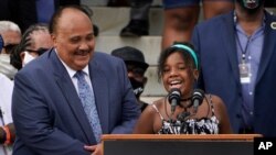 Yolanda Renee King, granddaughter of Martin Luther King Jr., speaks at the March on Washington, Aug. 28, 2020, at the Lincoln Memorial in Washington. At left is her father, Martin Luther King III.