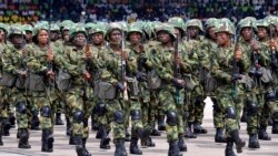Nigerian soldiers march during 58th anniversary celebrations of Nigerian independence, in Abuja, Nigeria, Monday, Oct. 1, 2018. (AP Photo/Olamikan Gbemiga)