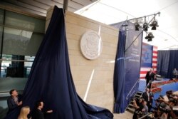 FILE - U.S. President Donald Trump's daughter Ivanka Trump, left, and U.S. Treasury Secretary Steve Mnuchin unveil an inauguration plaque during the opening ceremony of the new U.S. embassy in Jerusalem, May 14, 2018.