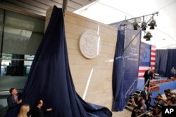 FILE - Former U.S. President Donald Trump's daughter Ivanka Trump (L) and former Treasury Secretary Steve Mnuchin unveil an inauguration plaque during the opening ceremony of the new U.S. embassy in Jerusalem, May 14, 2018.