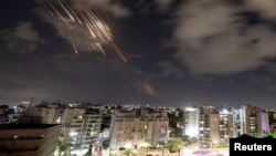 (FILE) Israel's Iron Dome anti-missile system intercepts rockets after Iran fired a salvo of ballistic missiles, as seen from Ashkelon, Israel, October 1, 2024.