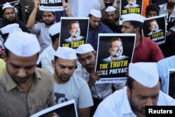 Supporters of the Youth Congress Party hold placards during a silent protest against the conviction of Rahul Gandhi, senior party leader of India's main opposition Congress party, in Mumbai