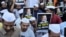 Supporters of the Youth Congress Party hold placards during a silent protest against the conviction of Rahul Gandhi, senior party leader of India's main opposition Congress party, in a 2019 Defamation case by a Surat court, on a street in Mumbai, India, March 23, 2023.