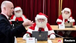 Students take part in a training session at the Ministry of Fun Santa School, as it develops an online app for children to speak with Santa during the Christmas season, as the continuation of the coronavirus disease (COVID-19) pandemic means most in-perso