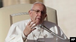 FILE - Pope Francis speaks during his weekly general audience in St. Peter square at the Vatican, Nov. 22, 2017. Pope Francis heads to Myanmar and Bangladesh.