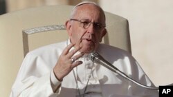 FILE - Pope Francis speaks during his weekly general audience in St. Peter square at the Vatican, Nov. 22, 2017. Pope Francis heads to Myanmar and Bangladesh.