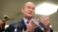 Sen. Chris Coons, a Delaware Democrat, gestures while speaking to reporters on Capitol Hill in Washington. 