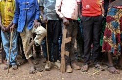 FILE - Former child soldiers stand in line waiting to be registered with UNICEF to receive a release package, in Yambio, South Sudan, Feb. 7, 2018.