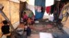 Internally displaced Syrian children from Idlib, are seen inside a tent in Azaz, Syria, Feb. 22, 2020.