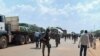 Troops from C.A.R. and Cameroon gather to escort trucks in Garoua Boulai, Cameroon, June 18, 2019. (M. Kindzeka/VOA)