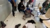 Journalists lie wounded after being shot by armed gangs at the general hospital in Port-au-Prince, Haiti, Dec. 24, 2024.