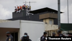 Inmates at Puraquequara's prison are seen on the roof during a riot, in Manuas, Brazil, May 2, 2020.