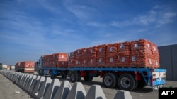 Trucks loaded with assistance  hold   to transverse  into Gaza from the Egyptian broadside  of the Rafah borderline  crossing connected  Jan. 19, 2025.