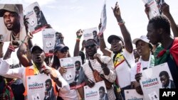 FILE —Supporters of presidential candidate Bassirou Diomaye and opposition leader Ousmane Sonko demonstrate in Dakar on February 24, 2024.