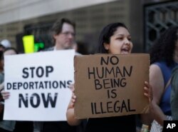 FILE - protesters rally outside a federal courthouse in Detroit. Protesters rallied in hopes public outcry will again delay the deportation of Jose Luis Sanchez-Ronquillo from the United States to Mexico.