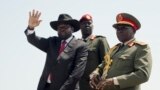 FILE - South Sudan's President Salva Kiir, accompanied by then-Army Chief of Staff Paul Malong, waves during an independence day ceremony in Juba, South Sudan, July 9, 2015. 