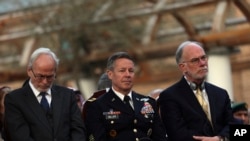 Gen. Scott Miller, center, chief of the U.S.-led coalition in Afghanistan, attends a joint news conference in the presidential palace in Kabul, Afghanistan, Feb. 29, 2020. 