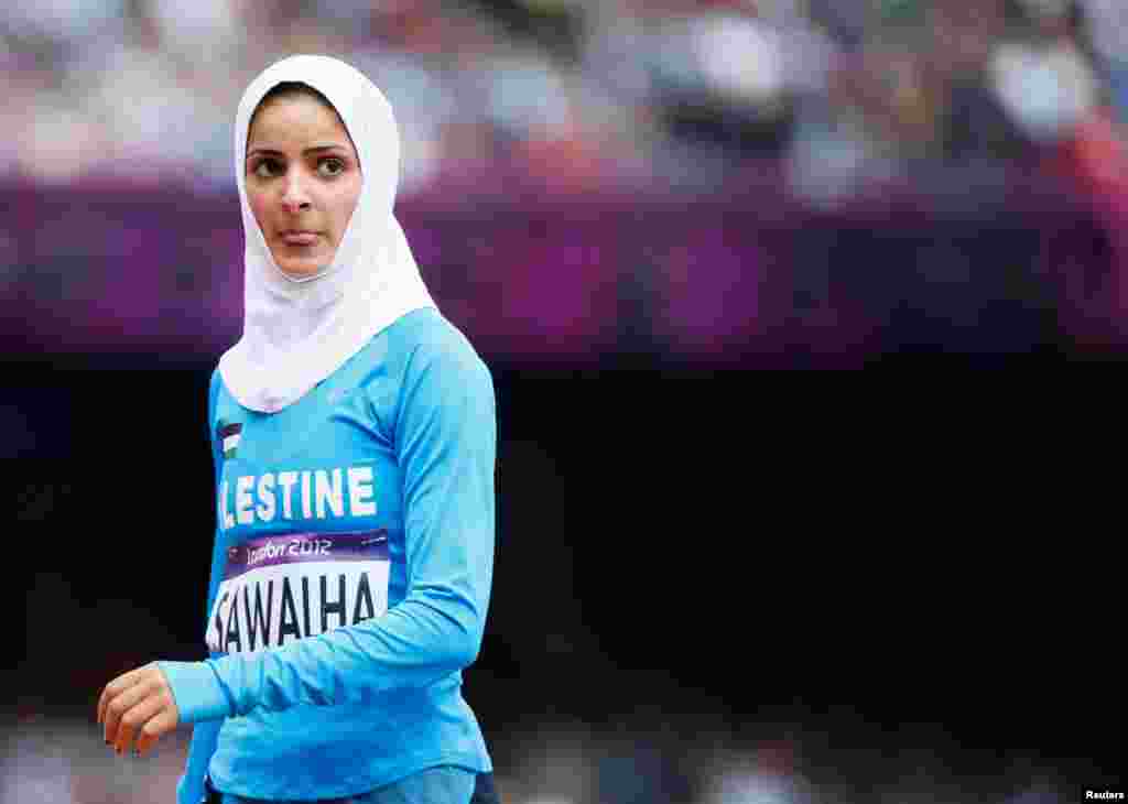 Woroud Sawalha stands after competing in the women&#39;s 800m round 1 heat. She did not qualify.