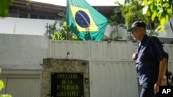 FILE - Brazil's flag flies at Argentina's embassy in Caracas, Venezuela, Aug. 1, 2024.