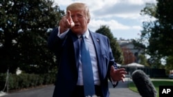 President Donald Trump talks to reporters on the South Lawn of the White House, Oct. 4, 2019, in Washington.