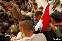 Fighters who were displaced by Islamic State gather at Debaga camp on the outskirts of Irbil, Iraq, before heading to the front line for the Mosul offensive against the group, Oct. 24, 2016.