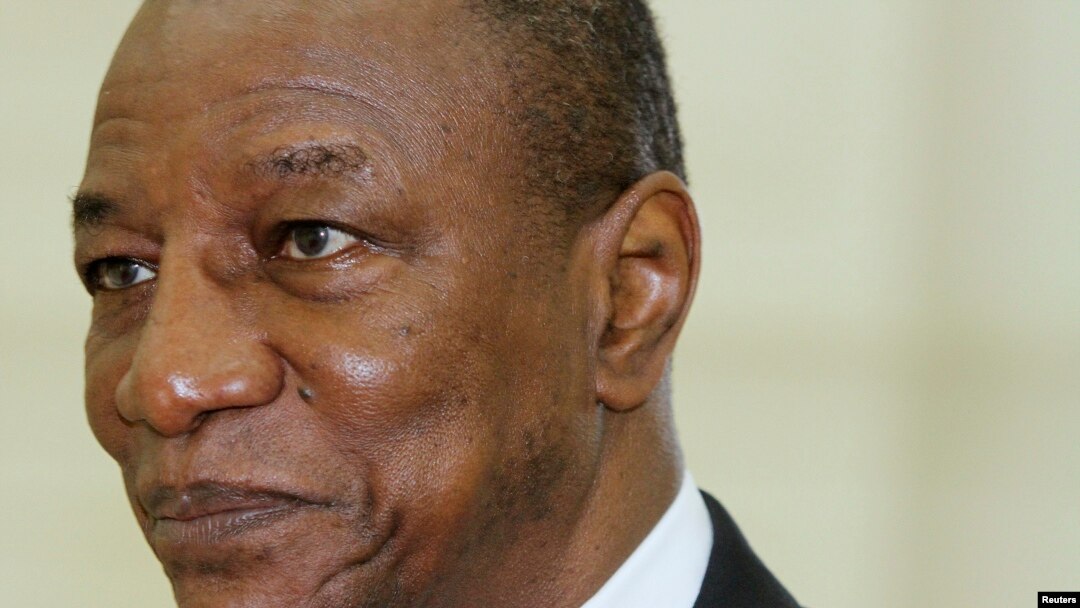 FILE - Guinea's President Alpha Conde