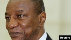 FILE - Guinea's President Alpha Conde