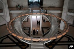 Visitors tour the new Museum of Islamic Art in Doha, Qatar, Wednesday, April 1, 2009.