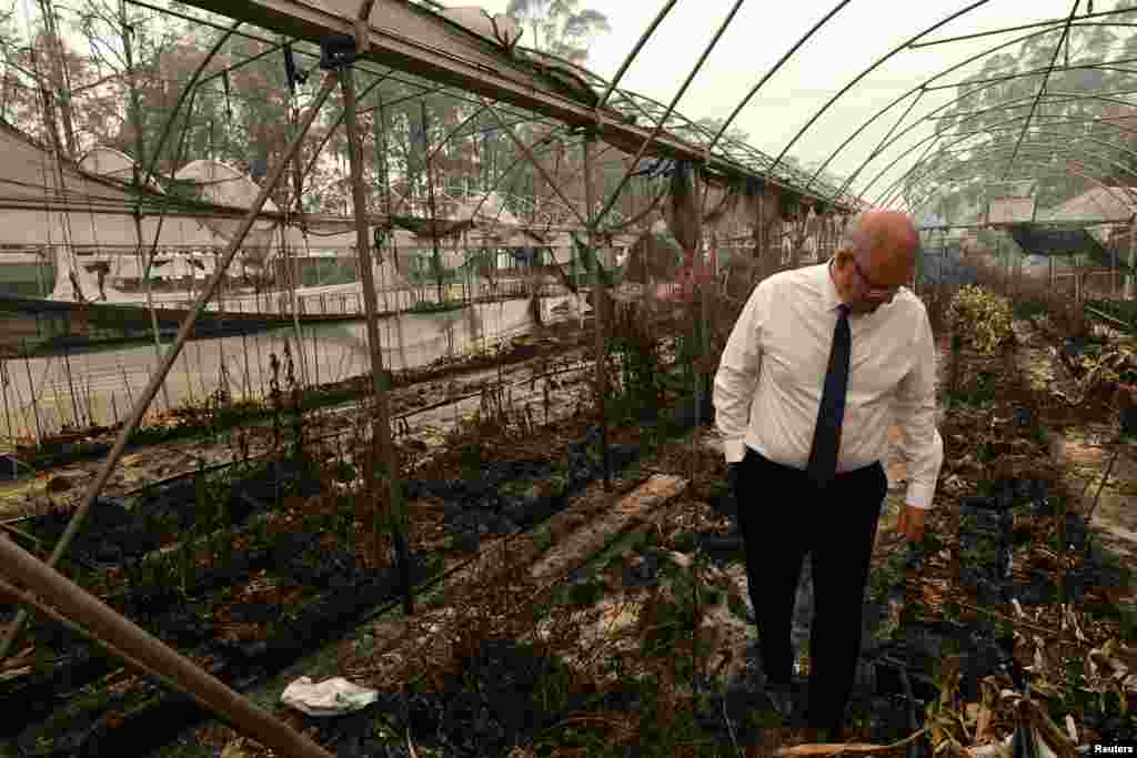 Australia&#39;s Prime Minister Scott Morrison tours the Wildflower farm owned by Paul and Melissa Churchman in Sarsfield, Victoria, Australia.