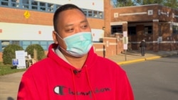 A Thai America first-time voter, Pipop Chankoh talks with VOA Thai at a polling station on Election Day in Springfield, VA, U.S., November 3, 2020.