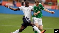 U.S. forward Jozy Altidore (17) and Germany defenseman Marcell Jansen (7) go for the ball during the first half of an international friendly soccer match at RFK Stadium, June 2, 2013, in Washington. 