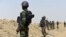 FILE - A picture taken on February 17, 2015, shows Cameroonian soldiers patrolling in the Cameroonian town of Fotokol, on the border with Nigeria, after clashes occurred between Cameroonian troops and Nigeria-based Boko Haram insurgents.
