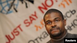 FILE - U.S. Army specialist Andre Shepherd listens to reporter's questions during a news conference in Frankfurt, Germany, Nov. 27, 2008. 