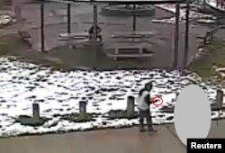 Tamir E. Rice, 12, is seen allegedly pointing a pellet gun at the Cudell Recreation Center in Cleveland, Ohio, in a still image from video released by the Cleveland Police Department Nov. 26, 2014.