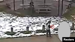 Tamir E. Rice, 12, is seen allegedly pointing a pellet gun at the Cudell Recreation Center in Cleveland, Ohio, in a still image from video released by the Cleveland Police Department Nov. 26, 2014.