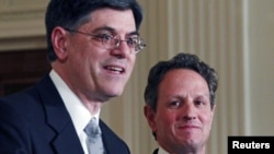 White House Chief of Staff Jack Lew (L) speaks alongside outgoing U.S. Treasury Secretary Timothy Geithner at the White House, January 10, 2013.