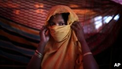 This 22-year-old mother of one, who did not want her name used, says she was raped by members of Myanmar's armed forces in late August. She is photographed in her tent in the Gundum refugee camp in Bangladesh, Nov. 23, 2017.