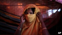 This 22-year-old mother of one, who did not want her name used, says she was raped by members of Myanmar's armed forces in late August. She is photographed in her tent in the Gundum refugee camp in Bangladesh, Nov. 23, 2017.