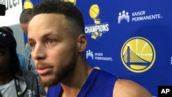 Golden State Warriors Stephen Curry takes questions from the media after NBA basketball practice in Oakland, California, Sept. 23, 2017.. 