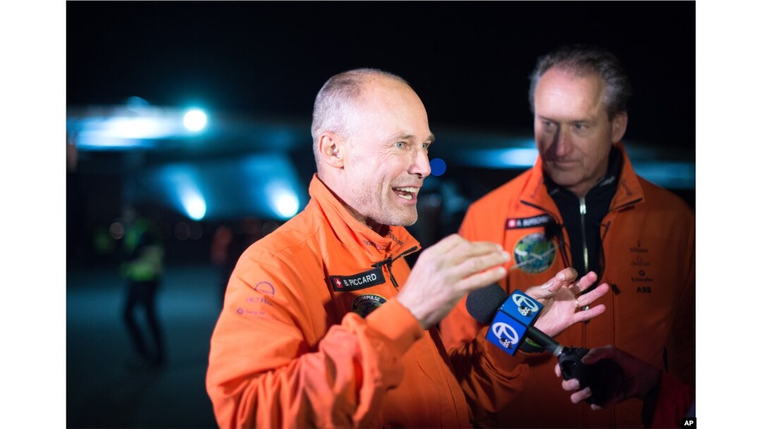 Solar Impulse 2 pilots Bertrand Piccard, left, and Andre Borschberg speak with reporters after their solar-powered plane landed at Moffett field in Mountain View, Calif., April 23, 2016.
