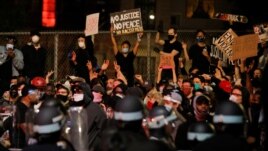 NYPD officers face demonstrators after curfew during a protest against the death in Minneapolis police custody of George Floyd, in New York City, U.S., June 2, 2020. REUTERS/Brendan Mcdermid