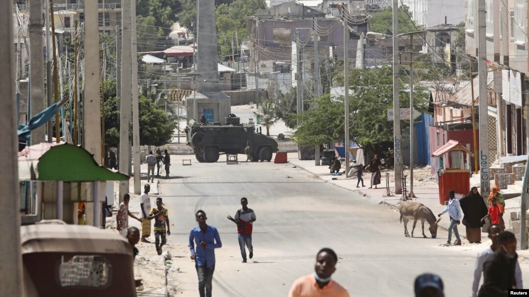 An armoured personnel carrier (APC) is seen on a sealed off street during fighting between Somali government forces and opposition troops over delayed elections in Mogadishu, Somalia, Feb. 19, 2021. 