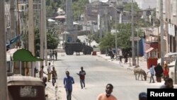 An armoured personnel carrier (APC) is seen on a sealed off street during fighting between Somali government forces and opposition troops over delayed elections in Mogadishu, Somalia, Feb. 19, 2021. 