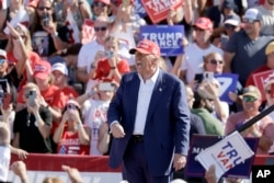 Republican presidential nominee former President Donald Trump shouts after speaking at a campaign event at Wilmington International Airport in Wilmington, North Carolina, Sept. 21, 2024.