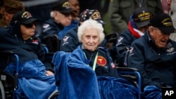 U.S war veterans attend a ceremony to mark the 79th anniversary of the assault that led to the liberation of France and Western Europe from Nazi control, at the American Cemetery in Colleville-sur-Mer, Normandy, France, Tuesday, June 6, 2023. The American Cemetery is home to the graves of 9,386 United States soldiers. Most of them lost their lives in the D-Day landings and ensuing operations. (AP Photo/Thomas Padilla)